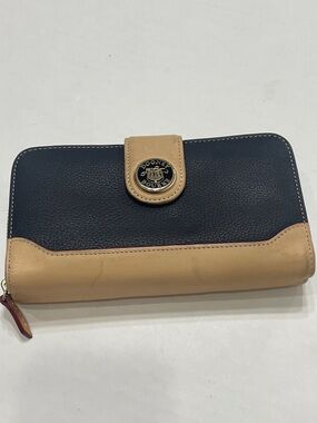 Dooney & Bourke Black and Tan Leather Zip-Around Wallet. Preowned. See condition